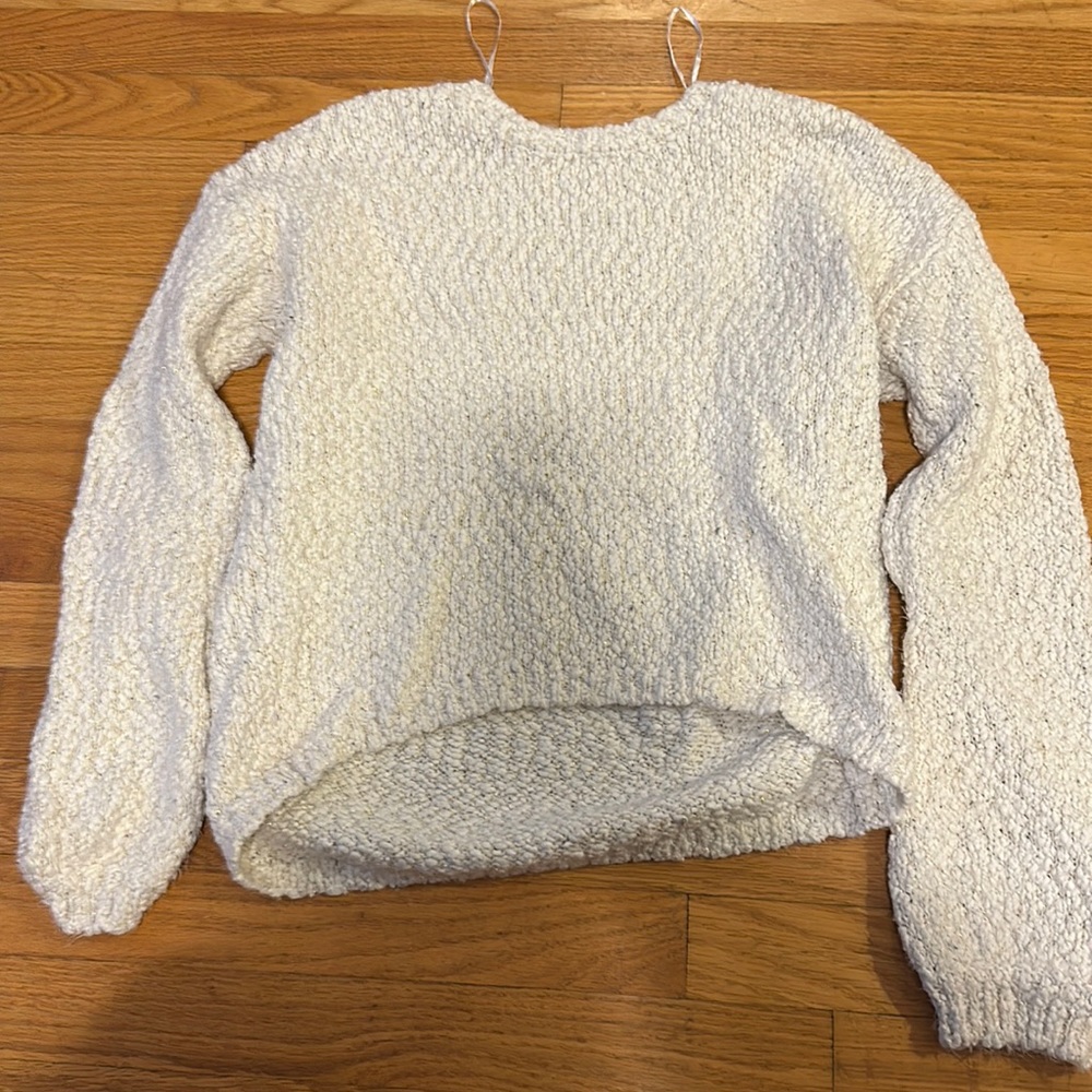 white and gold sweater